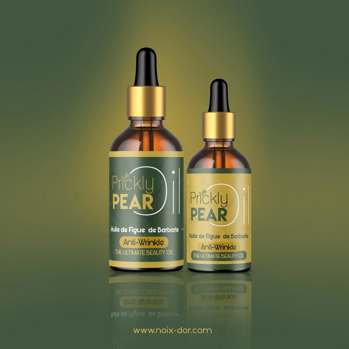 Two amber glass dropper bottles of Prickly Pear anti-wrinkle beauty oil on a green background.